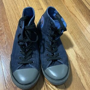 Blue high top Converse with grey accents